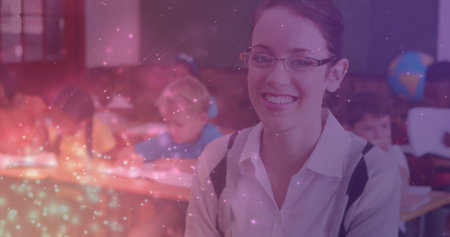 Image of light spots over happy caucasian female teacher with diverse schoolchildren. world teacher's day and celebration concept digitally generated image.の写真素材