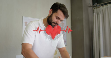 Image of heart over caucasian male massage therapist with female patient. massage at work and digital interface concept digitally generated image.の写真素材