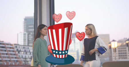 Image of hat in usa flag with hearts over diverse woman talking. american patriotism and business concept digitally generated image.の写真素材