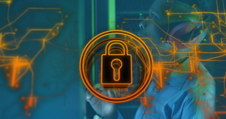 Image of icon padlock data processing over african american it man by computer servers. Global computing, digital interface and data processing concept digitally generated image.の写真素材