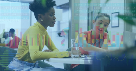 Image of financial data processing over diverse business people in office. Global business, finances, computing and data processing concept digitally generated image.の写真素材