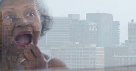 Image of senior african american woman doing make up over cityscape. Lifestyle, self care, beauty and domestic life concept digitally generated image.の写真素材