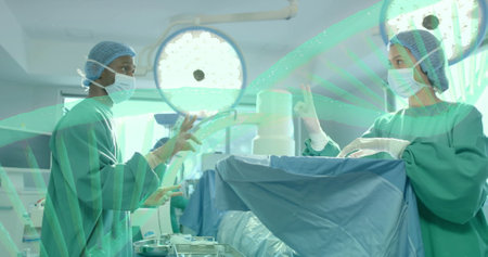 Surgeons in operating room performing surgery under bright surgical lights. healthcare, medical, operating theater, procedure, teamwork, healthcare professionalsの写真素材