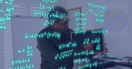 Image of data processing over biracial male teacher on image call. Global education, learning, school, digital interface and data processing concept digitally generated image.の写真素材