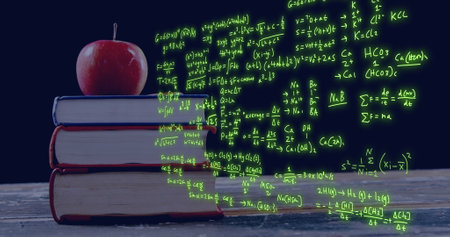 Image of scientific data processing over apple on stack of books. Global education, learning, school, digital interface and data processing concept digitally generated image.の写真素材