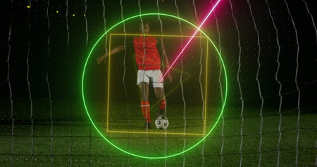 Image of neon geometrical shapes rotating over african american male soccer player. Sport, competition and movement concept digitally generated image.の写真素材