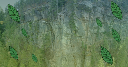 Image of leaves falling over landscape. International mountain day and celebration concept digitally generated image.の写真素材