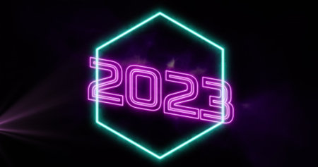 Image of neon 2023 number and shape over light trails. Social media and celebration concept...