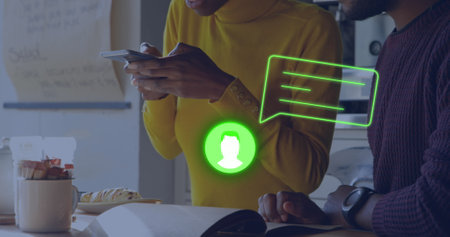 Image of neon profile and message icon against african american woman taking a picture at a cafe. Global networking and business technology conceptの写真素材
