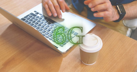 Image of neon 6g text banner against mid section of man using laptop at a cafe. Global networking...
