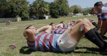Image of diverse male rugby players with rugby balls with flag of namibia over stadium. global sport...