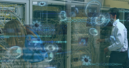 Image of data processing and scopes over caucasian workers in server room. Global business and digital interface concept digitally generated image.の写真素材