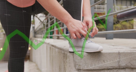 Image of data processing over caucasian woman exercising and tying shoe laces. Global sports, active lifestyle, computing and data processing concept digitally generated image.の写真素材