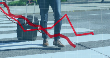Image of financial data processing with red lines over businessman crossing road. Global business, finances, computing and data processing concept digitally generated image.の写真素材