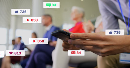 Image of media icons over caucasian businessman using smartphone. Social media and digital interface...