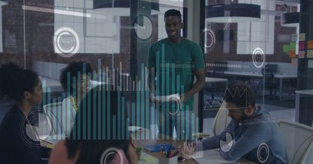 Image of data processing over african american man reading a document to his colleagues. Computer...
