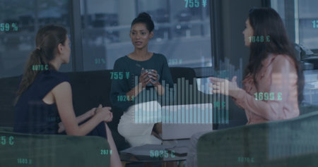 Image of statistical data processing over three diverse women discussing together at office. Global economy and business data technology conceptの写真素材