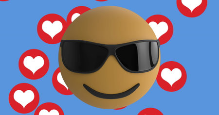 Face wearing sunglasses emoji over multiple red heart icons floating against blue background. social media networking and technology conceptの写真素材