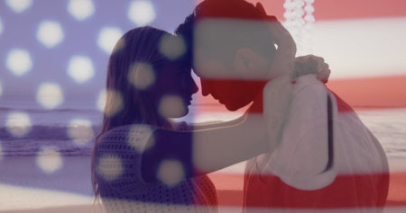 Image of flag of united states of america over happy diverse couple in love on beach. american patriotism and independence concept digitally generated image.の写真素材