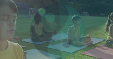 Image of ying yang icons over diverse children meditating. Health, fitness and digital interface concept digitally generated image.の写真素材