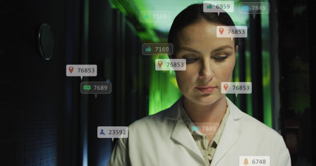 Image of social media icons over thoughtful caucasian female engineer working at server room. Social media networking and business data storage technology conceptの写真素材