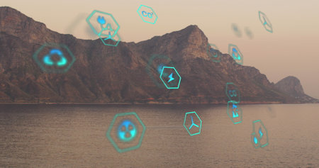 Image of sustainability and ecology icons over landscape. Ecology, sustainability and data processing concept digitally generated imageの写真素材