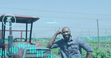 Image of financial data processing over african american male farmer by tractor. Global business, finances, computing and data processing concept digitally generated image.の写真素材