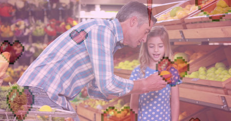Image of heart icons over caucasian father with daughter holding lemon. love and lifestyle concept digitally generated image.の写真素材