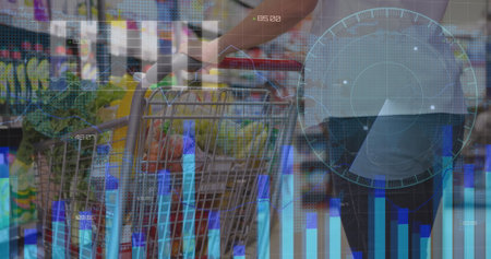 Image of financial data processing over shopping cart. Shopping and retail communication concept digitally generated image.の写真素材