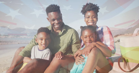 Image of flag of usa over african american family at beach. Patriotism and celebration concept digitally generated image.の写真素材