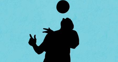 Image of football player silhouette over shapes on blue background. Sport, competition and movement concept digitally generated image.の写真素材