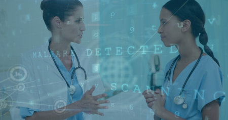Image of connected icons, texts, letters, symbols, diverse female doctors having conversation. Digital composite, multiple exposure, communication, password, medical and healthcare concept.の写真素材