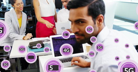 Image of 4g, 5g text and symbols in circles over diverse coworkers discussing reports in office....