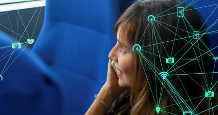 Image of connected icons globes, caucasian woman talking on cellphone while travelling in train....
