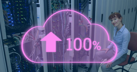 Image of cloud with increasing number over smiling caucasian woman sitting at servers. cloud...