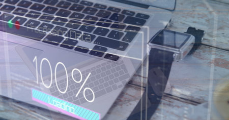 Image of data processing against close up of laptop and smartwatch cup on a wooden table. Computer...
