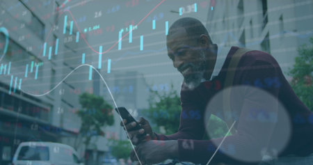 Image of multiple graphs, trading board, african american smiling while scrolling on cellphone....