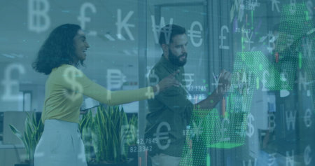 Image of currency symbols financial data processing over diverse business people in office. Global finance, business, connections, computing and data processing concept digitally generated image.の写真素材