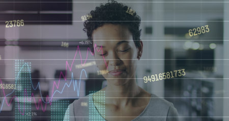 Image of statistical data processing over portrait of african american woman smiling at office....