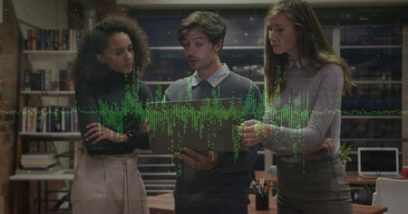 Image of soundwave and graphs over diverse coworkers discussing strategies over laptop. Digital composite, multiple exposure, report, office, teamwork, communication and technology concept.の写真素材