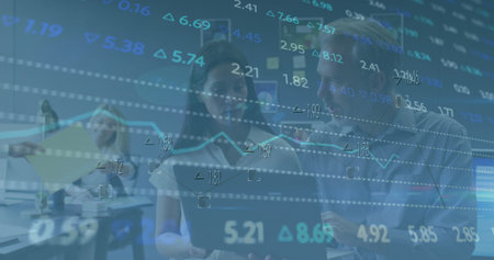 Image of stock market data processing over diverse colleagues discussing over laptop at office....