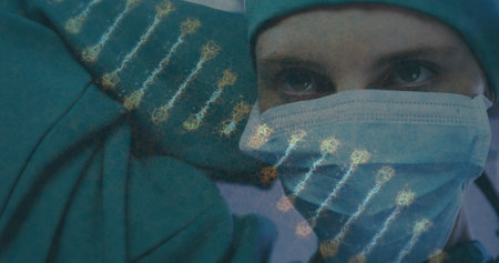 Image of dna strand over caucasian female surgeon in face mask. global research, medicine and healthcare services concept digitally generated image.の写真素材