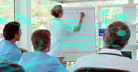 Image of data processing against caucasian female doctors giving a presentation at hospital. Medical...