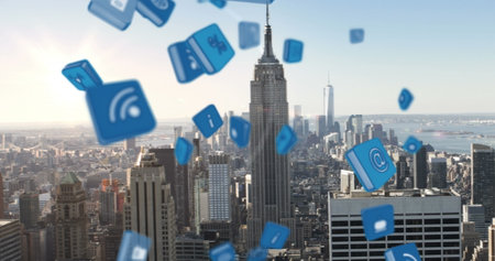 Image of falling 3d icons over aerial view of modern cityscape against sky. Digital composite, multiple exposure, protection, globalization, skyscrapers and architecture concept.の写真素材