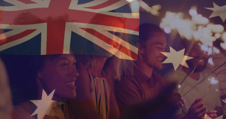 Composite image of australia flag over group of diverse friends celebrating with sparklers at beach. Partriotism and independence day celebration conceptの写真素材