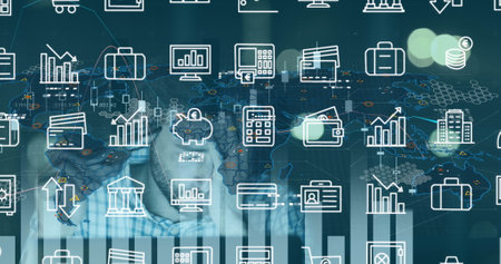 Image of data processing and business icons over caucasian businessman using laptop. Global business and digital interface concept digitally generated image.の写真素材