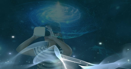 Image of waves over caucasian girl in vr headset. Virtual reality and technology concept digitally...