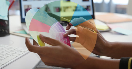 Image of diagram icon over caucasian businesswoman using tablet in office. Global business and digital interface concept digitally generated image.の写真素材