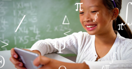 Image of mathematical symbols over asian girl using smartphone. Global education and digital interface concept digitally generated image.の写真素材