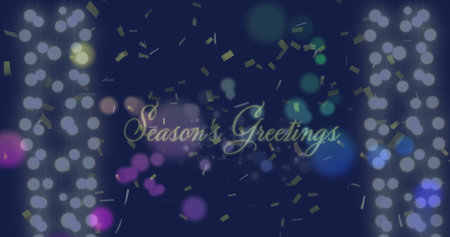Image of confetti falling and light spots over season&#39;s greetings text on black background. Christmas, tradition and celebration concept digitally generated image.の写真素材